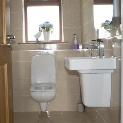 Cream bathroom revamp Cream toilet and sink remodel